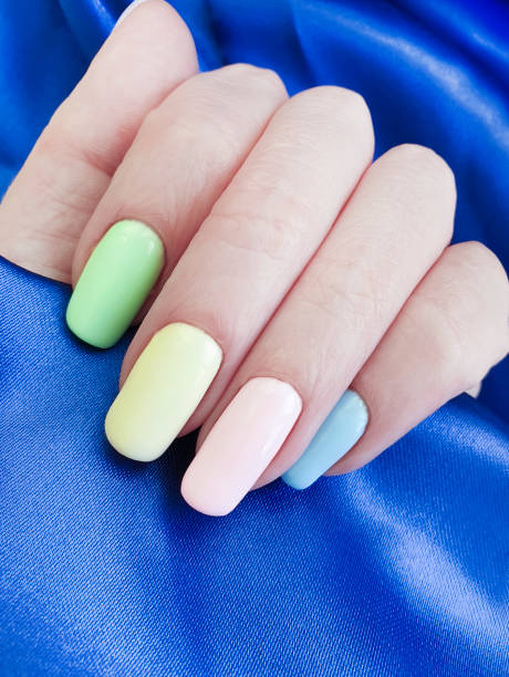 istock female hand manicure colored silk fabric 1140430970