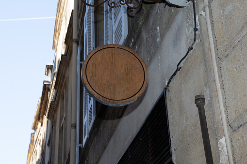wood blank round shop sign in street store city