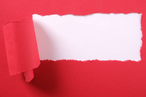 istock Torn red paper strip ripped edge frame white background 1140433733