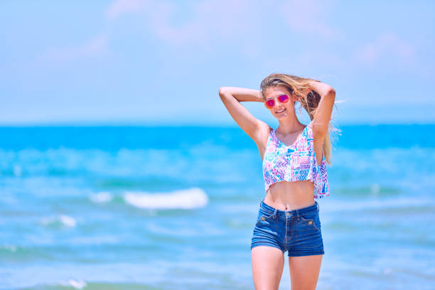 istock Happy Girl having fun on tropical beach 1140436106