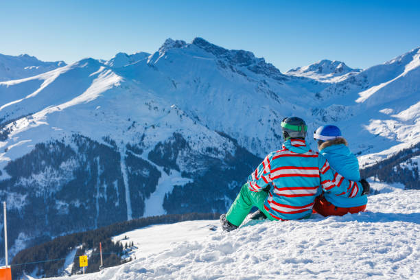 istock Two skiers resting in the winter ski resort. 1140436351