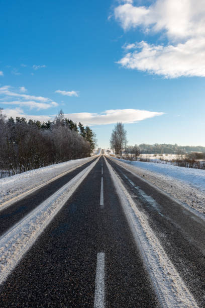 istock snowy winter road covered in ice and snow 1140436475