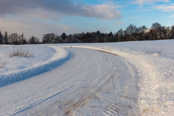 istock snowy winter road covered in ice and snow 1140436490