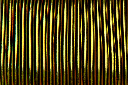 Background texture of gold rope close-up.