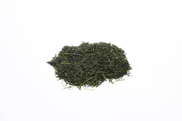 istock roasted japanese tea leaves in a white back ground 1140440714