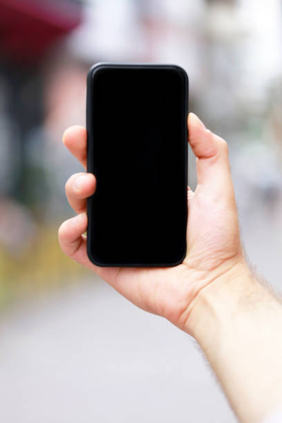 istock Man with smart phone on hand, blurred background. 1140446658