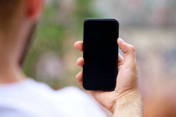 istock Man with smart phone on hand, blurred background. 1140447460