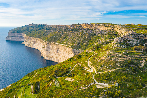 Aerial view of Dingli cliffs. Greeny nature and blue sea and sky. Malta