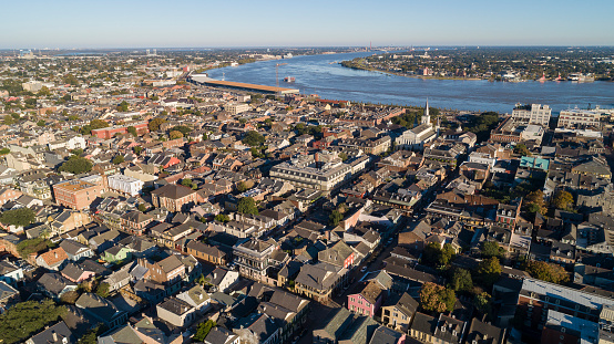 The aerial panoramic view of New Orleans at sunset. The Mississippi River and the historic French Quarter. Louisiana, USA.