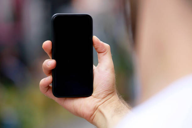 istock Man with smart phone on hand, blurred background. 1140451266