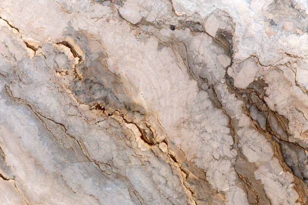 istock Gold and white patterned real natural marble stone texture background for product design 1140453068