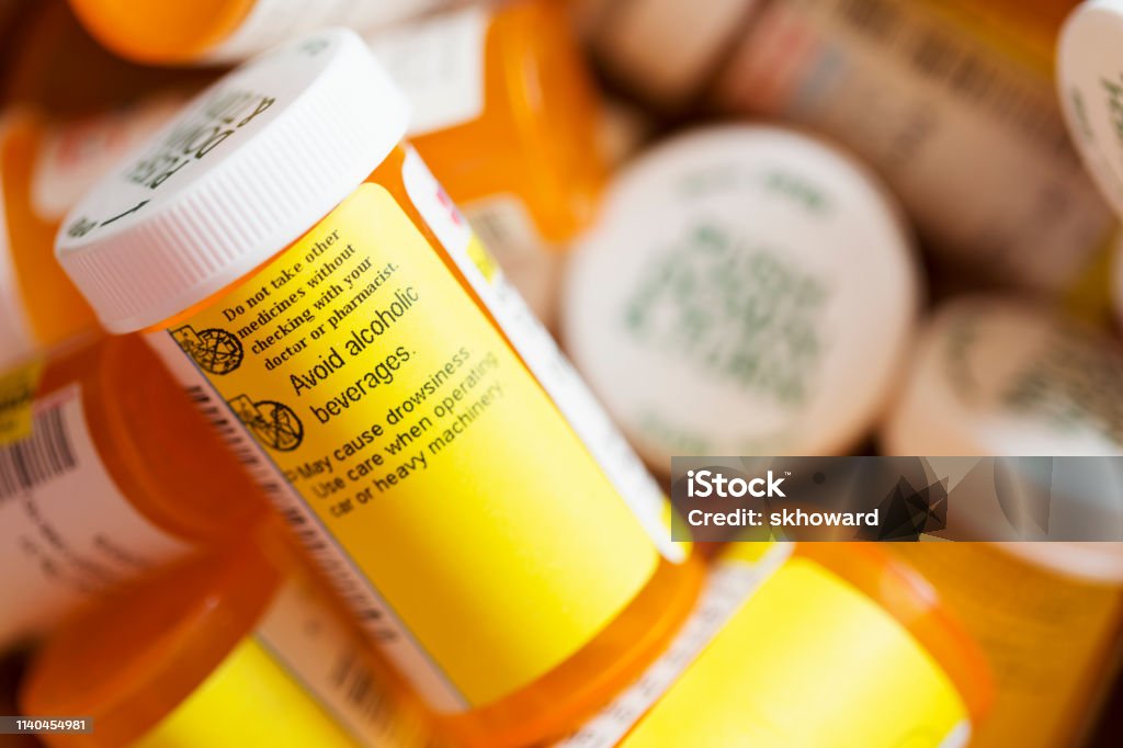 Prescription Medicine - Several Pill Bottles Several prescription medicine pill bottles. One with warning not to take medication with alcohol. Pill Bottle Stock Photo