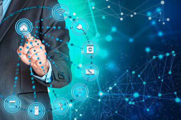 istock Business man playing a virtual screen controlling the Internet of things. 1140456563