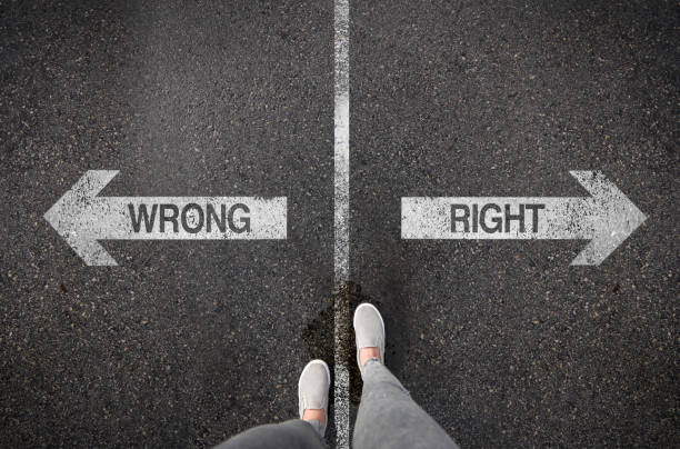 istock Woman standing next to painted arrows 1140458735