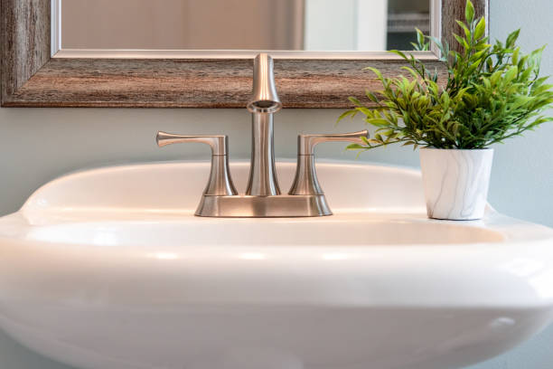 istock Bathroom sink with brushed nickel faucet - home interior design 1140459037