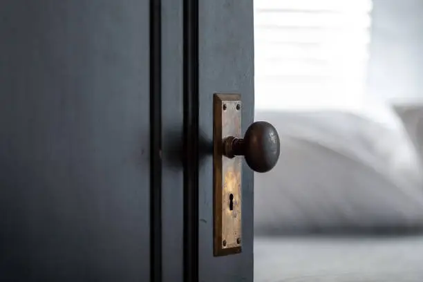 Closeup of doorknob and keyhole in old house - vintage detail