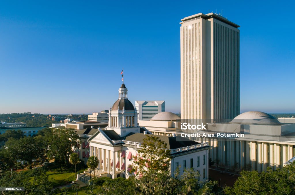 The Florida State Capitol, Tallahassee. The Florida State Capitol, Tallahassee. Aerial drone shoot. The perfectly round lake in the pine forest in Florida. Tallahassee Stock Photo