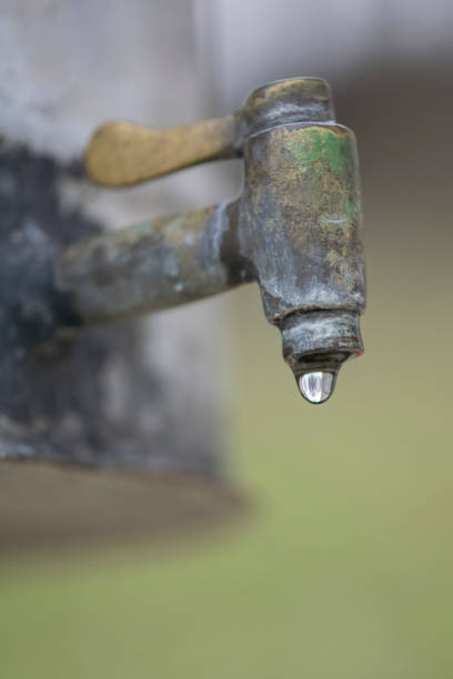 istock Old Water Tap in the Open and Water Drops - Image 1140464287