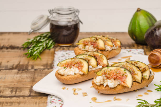 istock Swedish toasts with figs, cheese, rosemary, honey and walnuts 1140464431