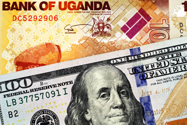 istock A Ugandan thousand shilling bank note with an American one hundred dollar bill 1140465431