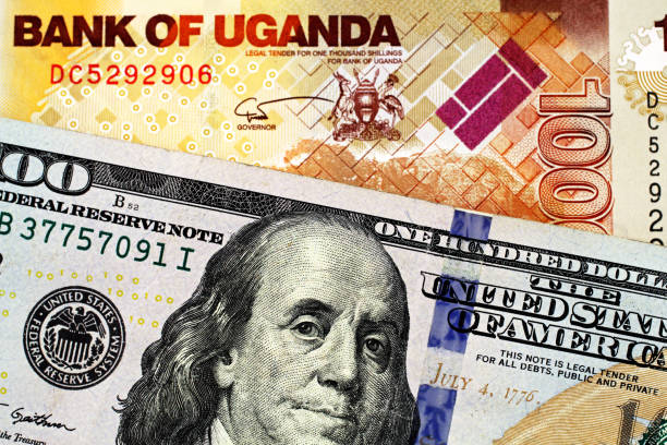 istock A Ugandan thousand shilling bank note with an American one hundred dollar bill 1140465501