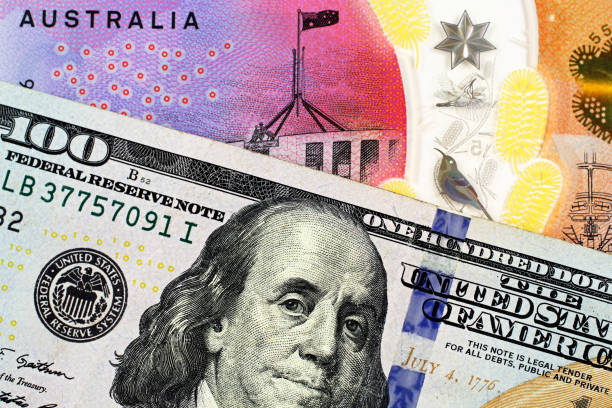 istock An Australian one dollar bill with a an American one hundred dollar bill 1140466395