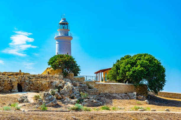 istock White lighthouse situated in Paphos Archaeological Park on Cyprus 1140466479