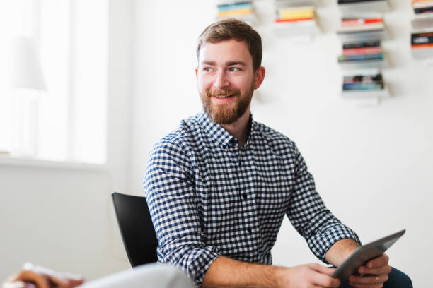 istock Young man attending a relaxed meeting 1140467251