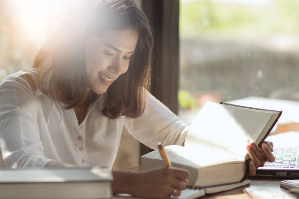 istock Asia woman reading working with intention and happy. 1140467387