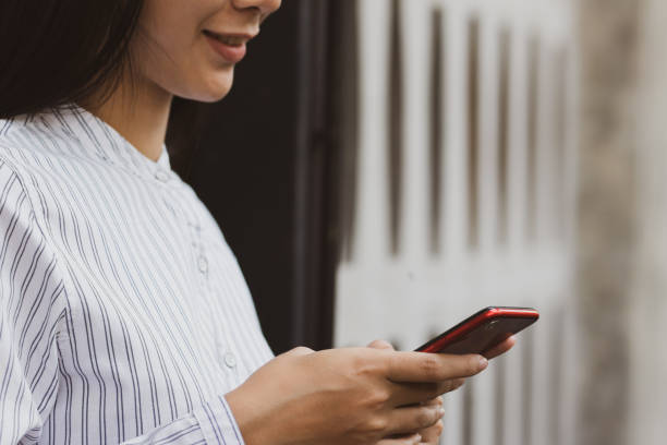 istock Asia woman using smartphone with happy. 1140467507