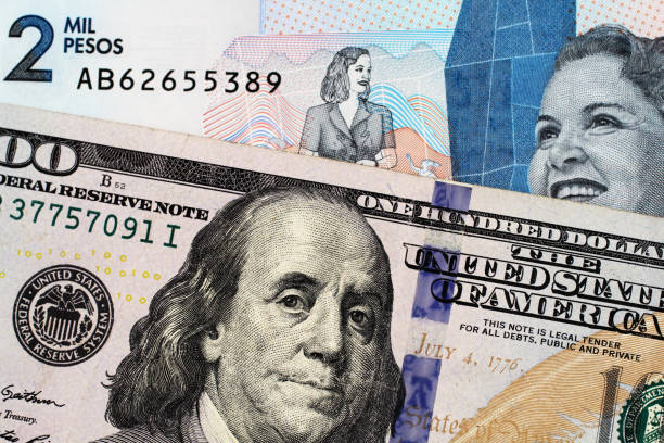 istock Macro image of a two thousand Colmbian peso note with an American hundred dollar bill 1140467654