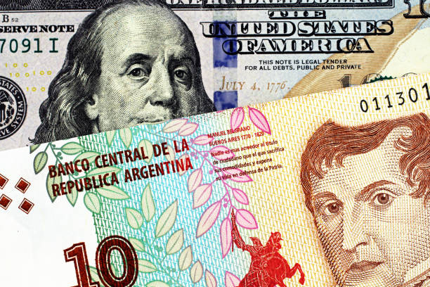 istock A ten peso bank note from Argentina with an American one hundred dollar bill 1140468325