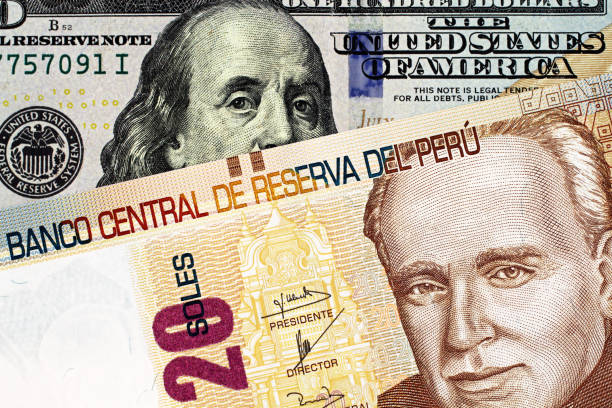 istock A close up up image of a Peruvian bank note with an American one hundred dollar bill 1140468480