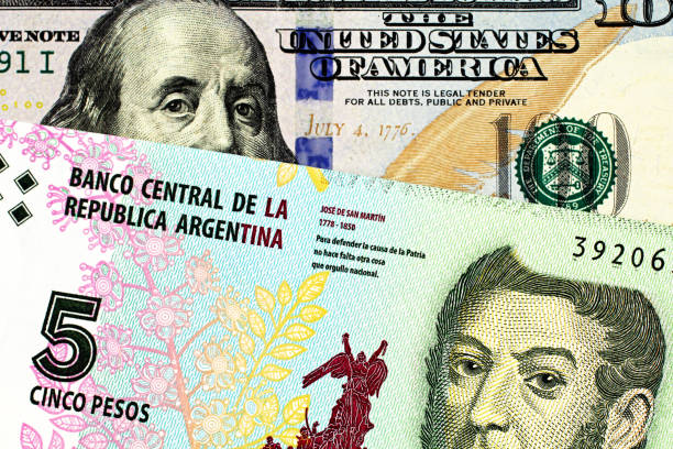 istock A five peso bank note from Argentina with an American one hundred dollar bill 1140469331