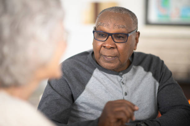 istock Senior man talking with friends 1140471422