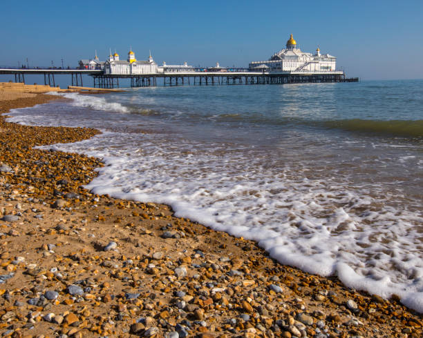 Eastbourne Pier in Eastbourne, Sussex, UK A view of the historic Eastbourne Pier in Eastbourne, East Sussex, UK. eastbourne pier photos stock pictures, royalty-free photos & images
