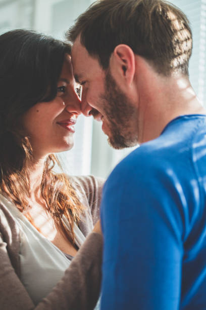 istock Man and woman standing face to face 1140471711