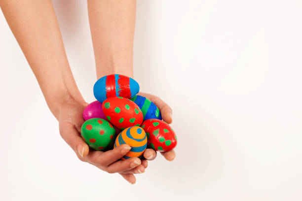 istock beautiful young woman holding easter eggs basket 1140472160