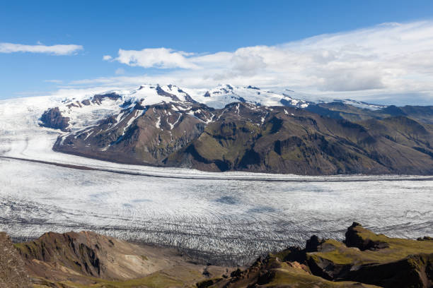 istock Skaftafellsjokull glacial river going down the volcano mountain. 1140477100