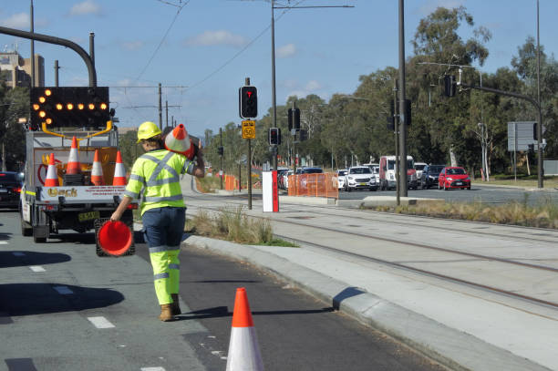 Australian woman road worker Canberra, Australia - March 01, 2019: Australian woman road worker. traffic cone photos stock pictures, royalty-free photos & images