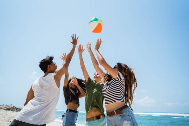 istock Group of cheerful young people playing with volley ball 1140488626