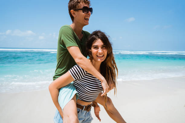 istock woman carrying their man on their back 1140489469