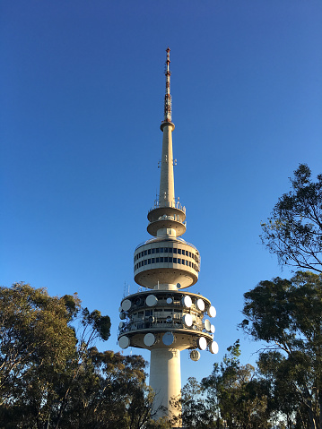 Canberra, Australia - February 23 2019:Telstra Tower a telecommunications tower and lookout that is situated above the summit of Black Mountain in Australia's capital city of Canberra.