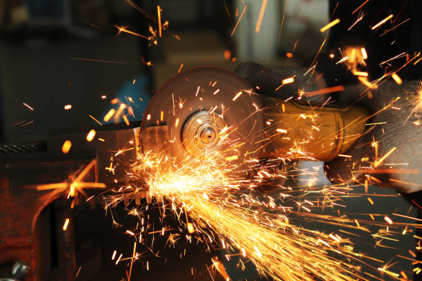 istock worker in gloves at the enterprise works as a grinder 1140501295