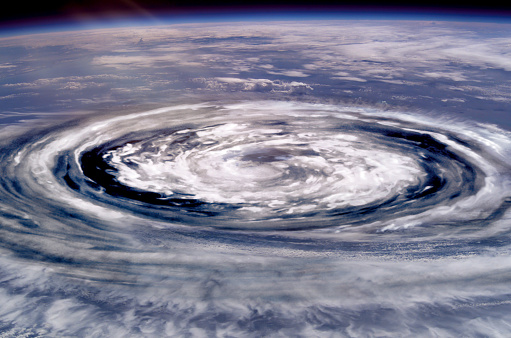Collage of a giant hurricane funnel. Elements of this image furnished by NASA.

/urls:
https://images.nasa.gov/details-iss008e19643.html
https://solarsystem.nasa.gov/resources/15678/vortex-at-saturns-north-pole/