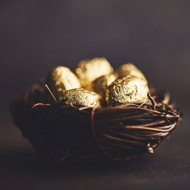 istock Gold eggs in nest. Easter still life 1140503312