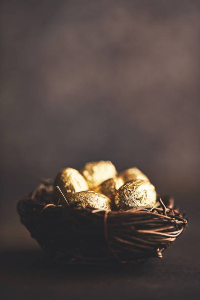 Gold eggs in nest. Easter background Gold eggs in nest. Easter background soft nest stock pictures, royalty-free photos & images