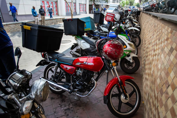 Johannesburg, South Africa, 22nd March- 2019: Delivery bikes parked outside train station.