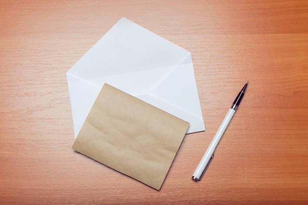 istock Photo of blank envelope on a  wooden background 1140510014