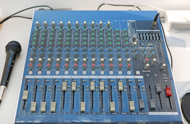 istock Sound levels on a professional audio mixer with microphone, Music control panel. 1140510409